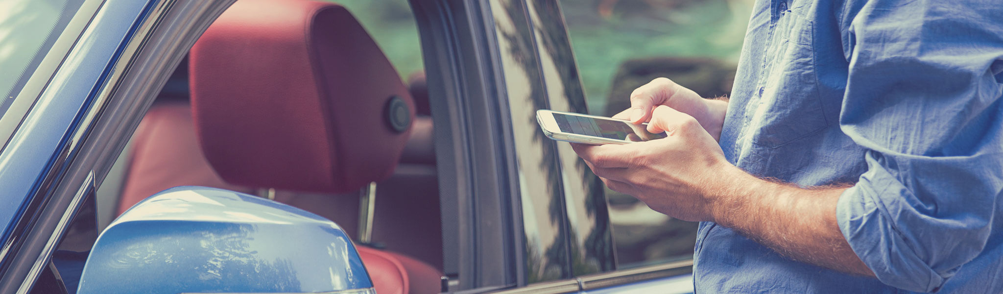 Person By Car With Phone