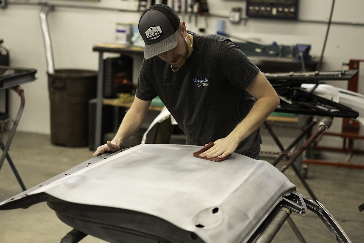 Man Sanding Part