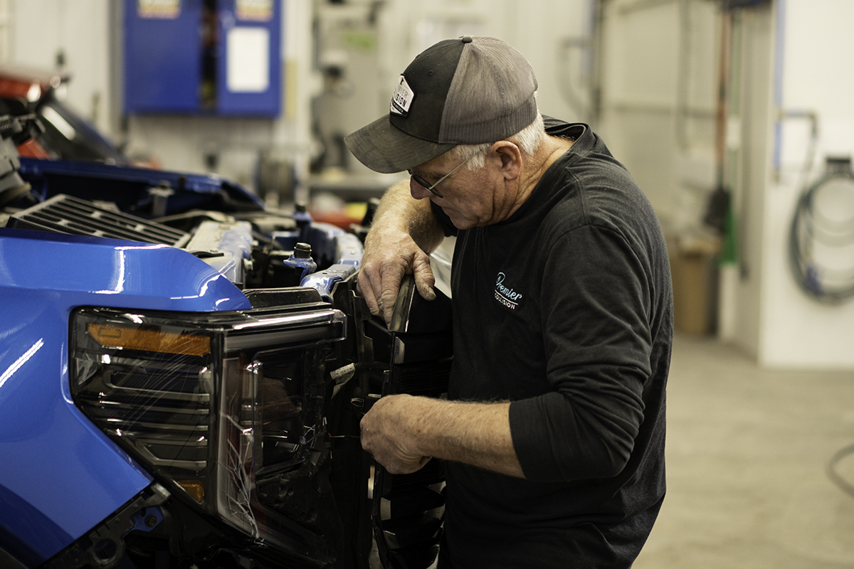 Man Replacing Part